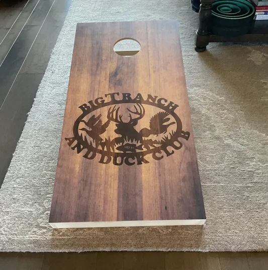 cornhole board with wood grain finish and wildlife silhouette logo