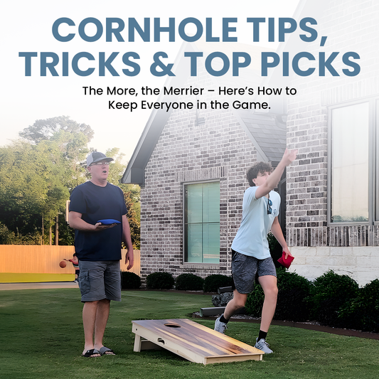 A man and a younger player playing cornhole on a grassy lawn