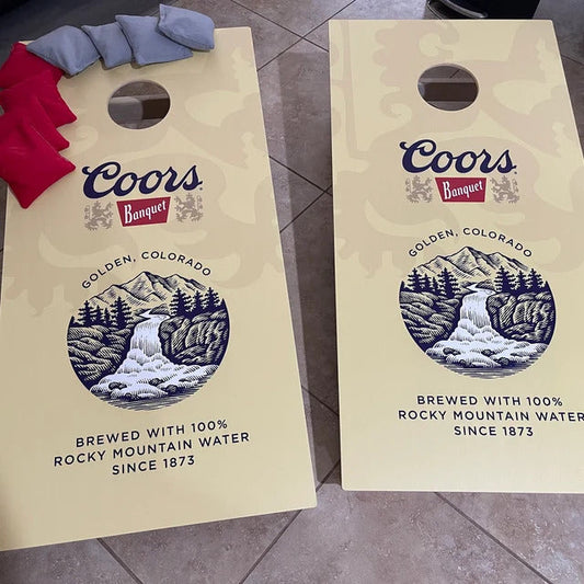 Coors Banquet themed cornhole boards with red and grey bean bags.