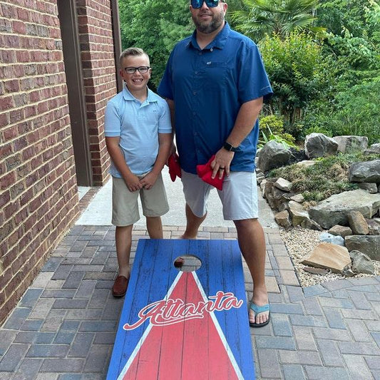 playing cornhole with dad after school