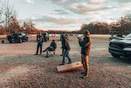 playing cornhole outside with friends