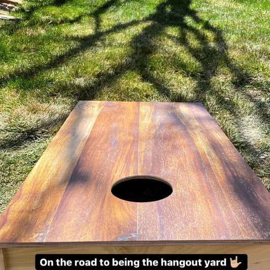 cornhole boards in the backyard