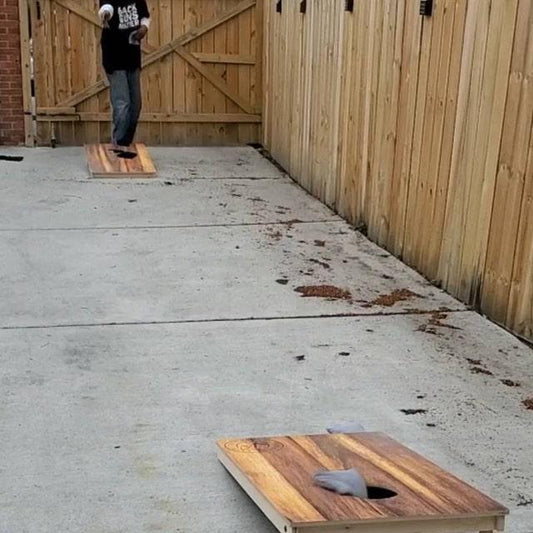 cornhole board distance between 