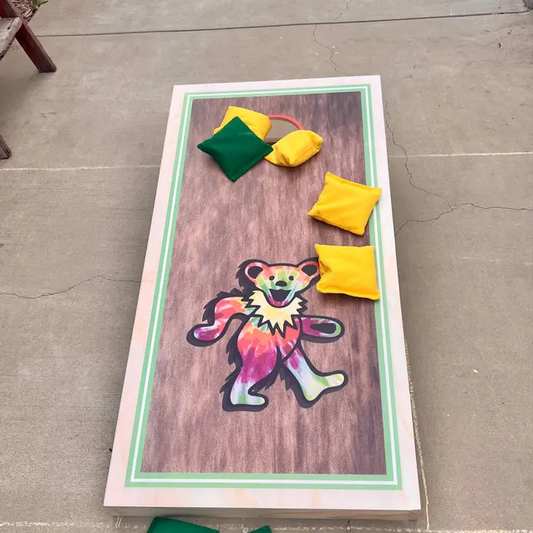 Custom cornhole board with colorful bear artwork