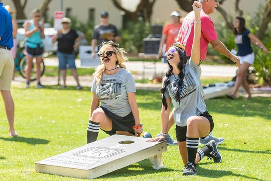 image of team girl playing cornhole