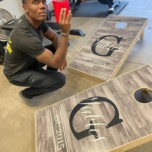 man with his newly designed cornhole boards