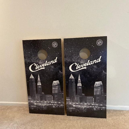 Cleveland skyline cornhole boards with a starry night