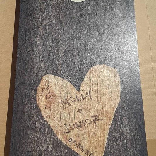 cornhole board featuring a light wood heart
