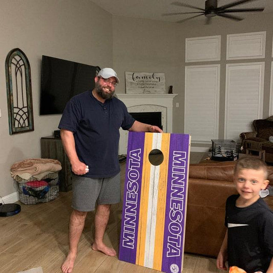 kid playing cornhole