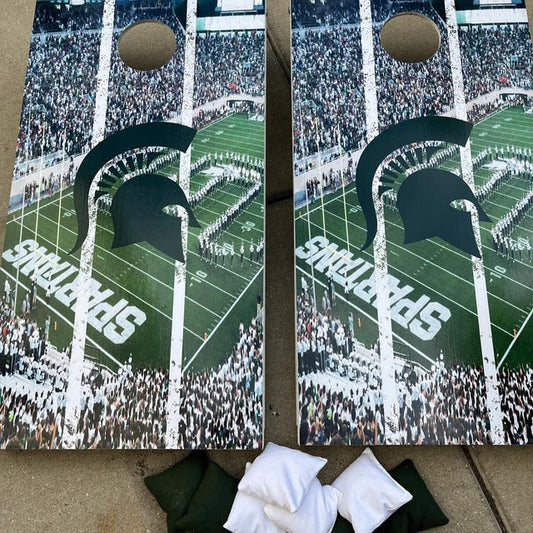 Two Michigan State Spartans-themed cornhole boards