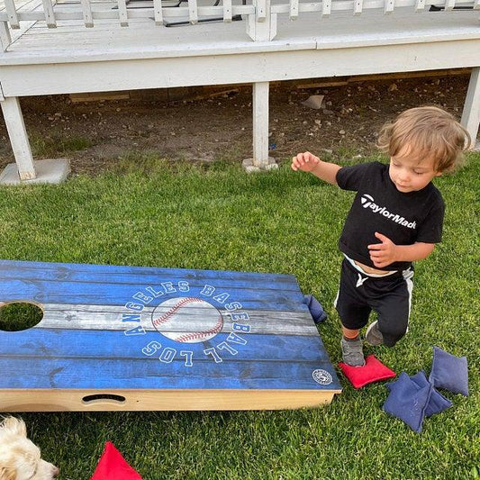 playing cornhole at the new house
