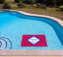 Arkansas State Flag poolmat in water
